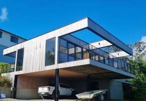 New home with tree top and ocean views, Dunedin